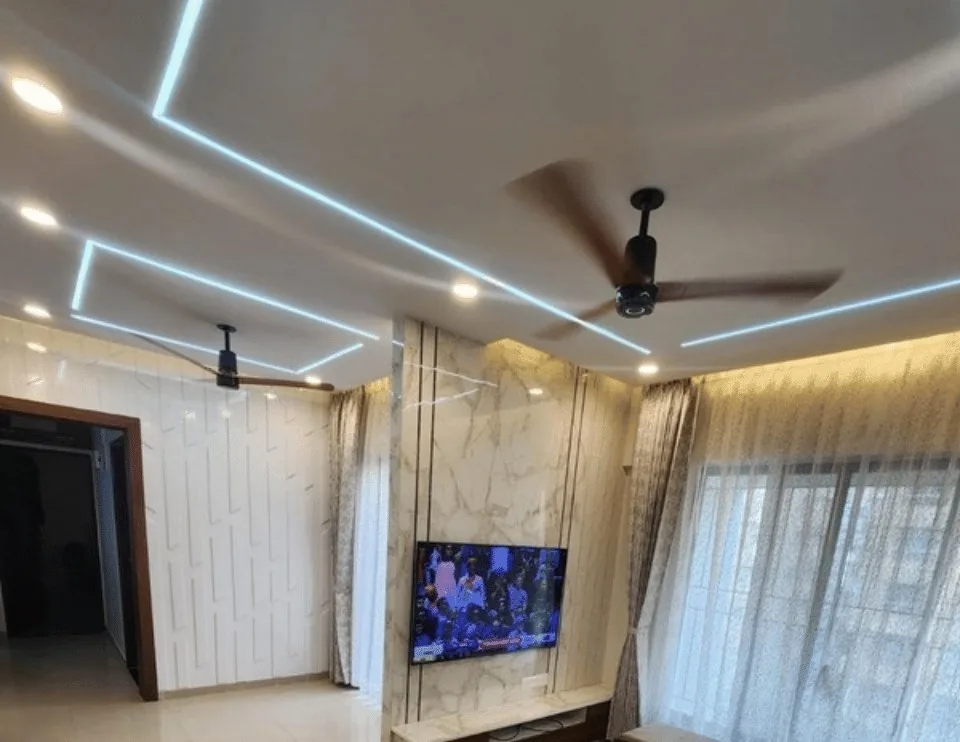 Delivered living room with LED profile ceiling and marble TV unit — 2 BHK, Konark Exotica, Wagholi