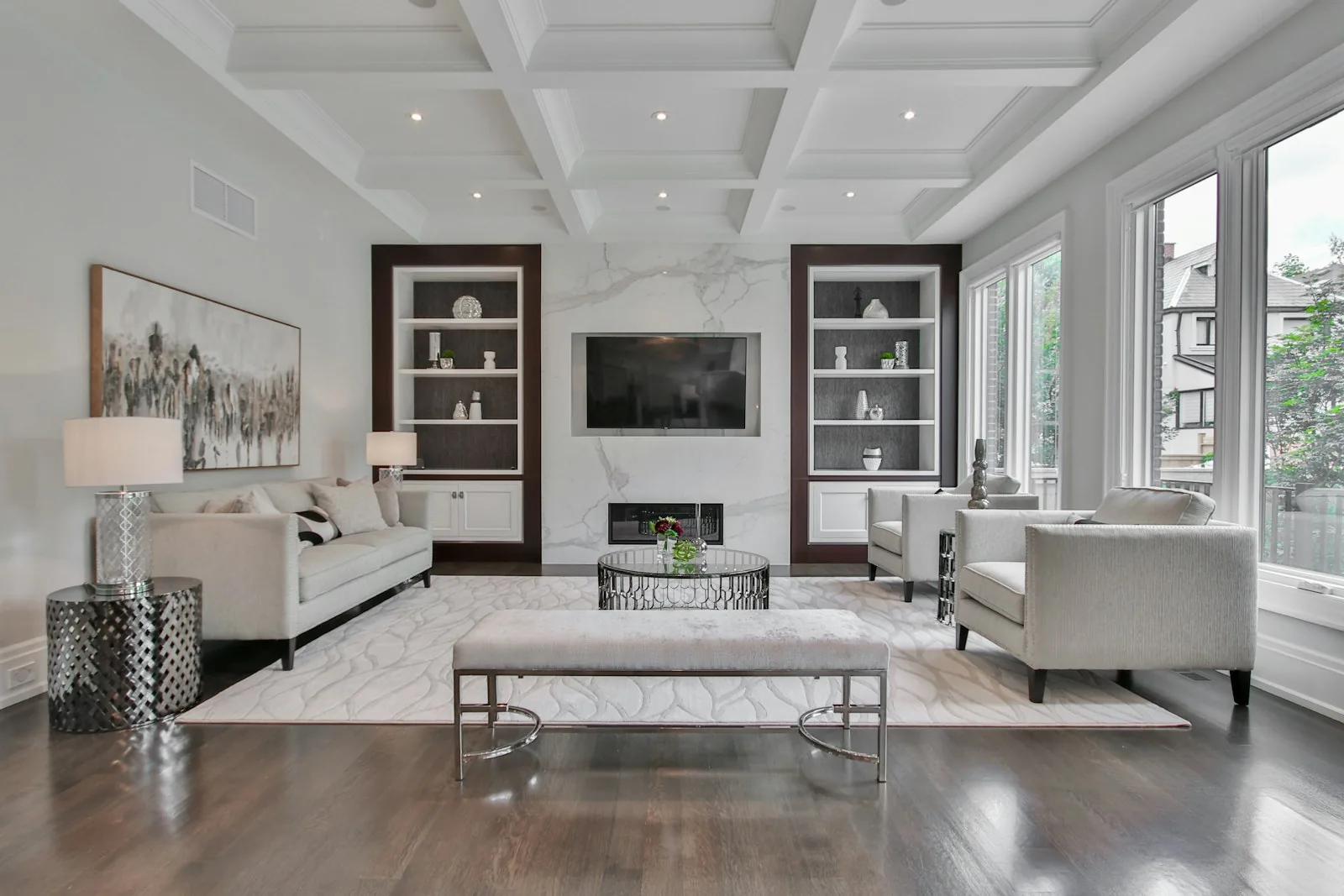 Coffered ceiling living room with built-in shelving — premium home interior design Pune