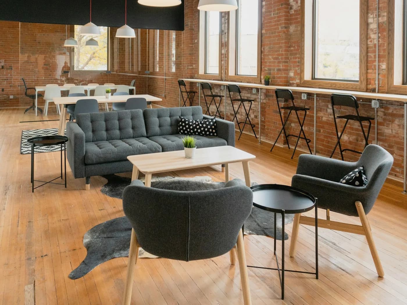 Industrial loft lounge with grey sofas — cafe and lounge interiors Pune