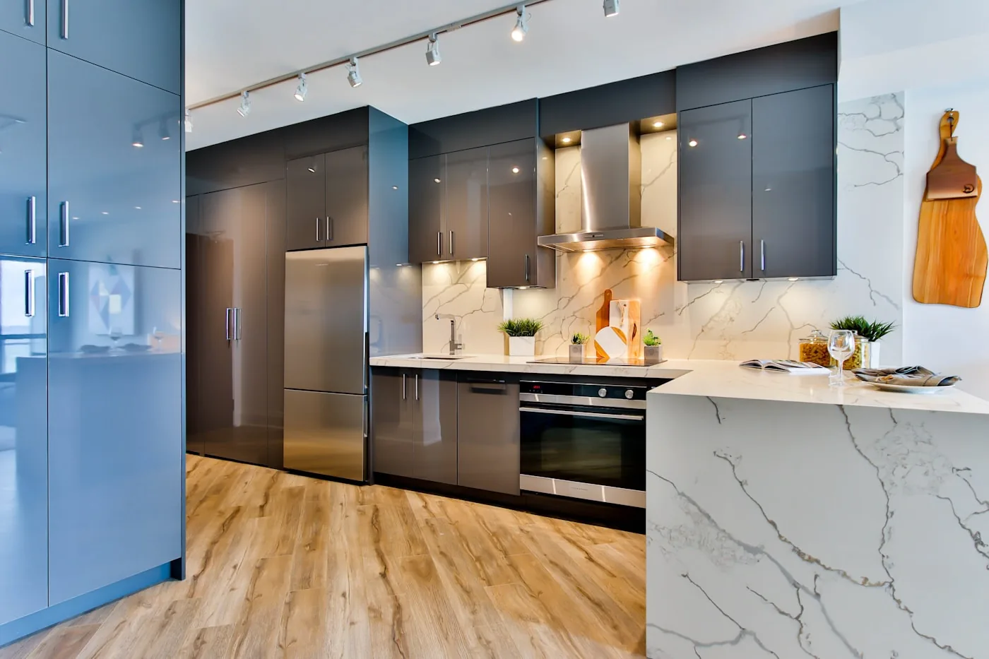 Navy modular kitchen with marble island and pendant lights — island kitchen design Pune