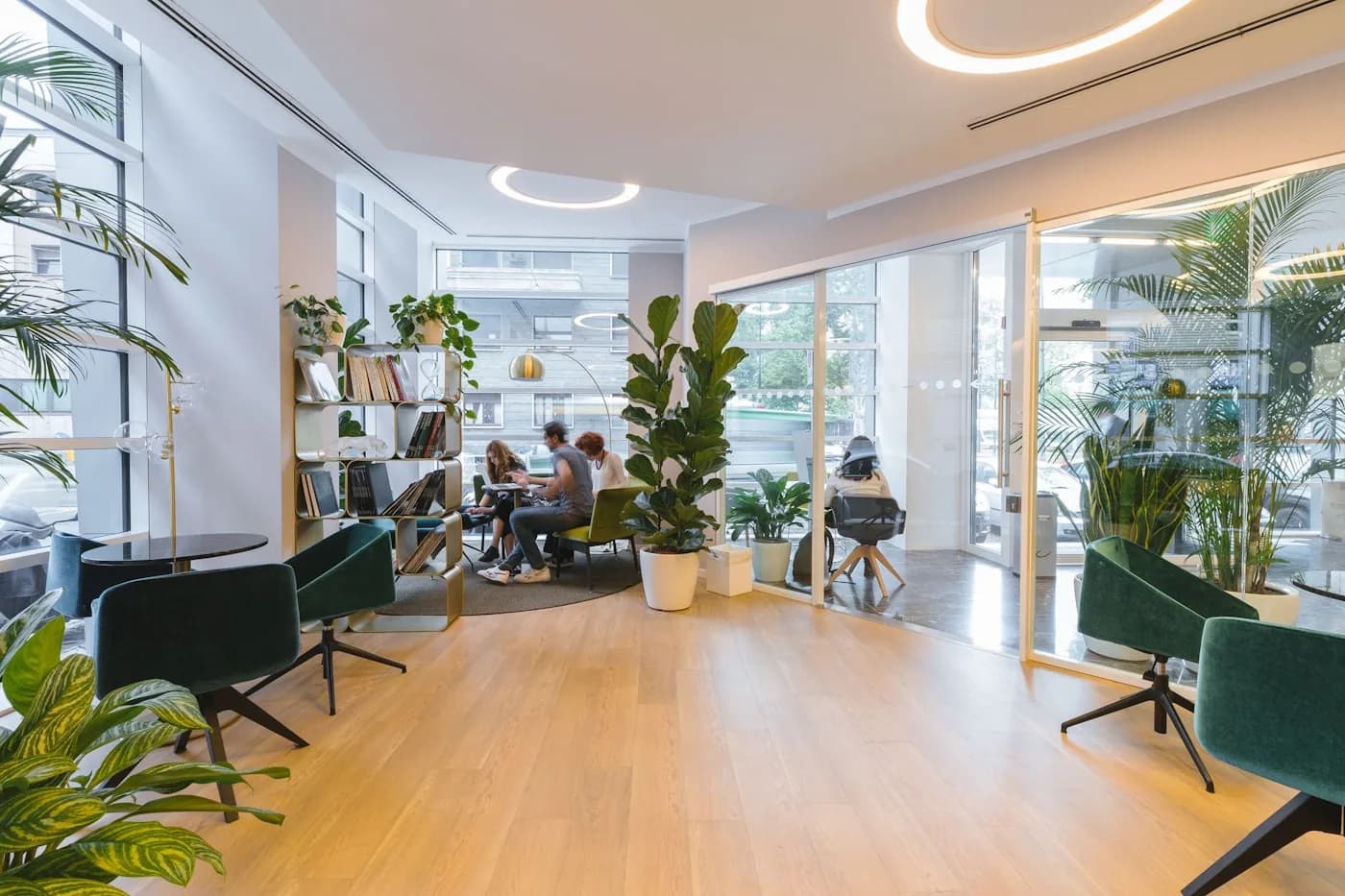 Modern plant-filled office lounge — office interior design Pune