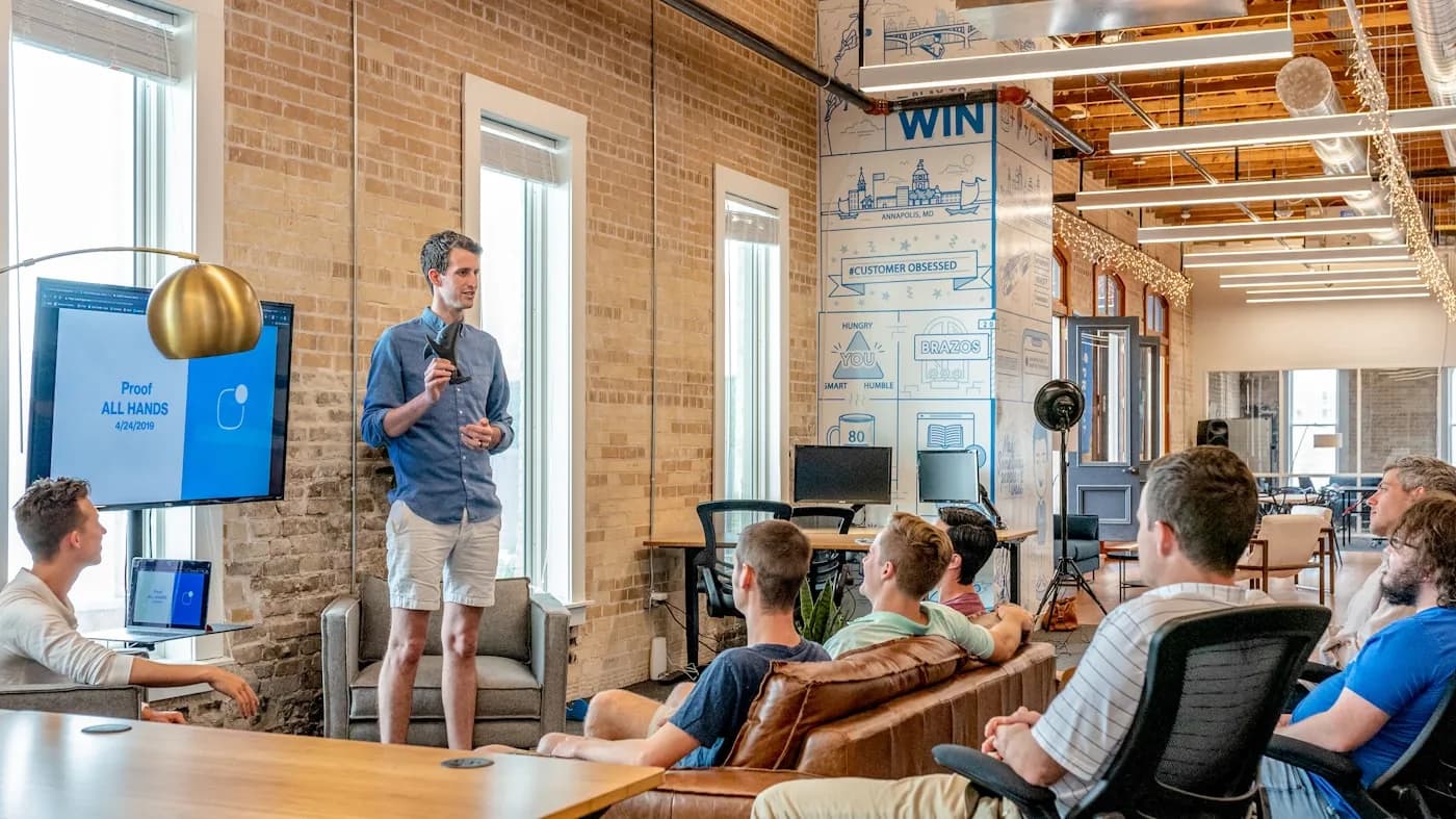 Team collaborating in a loft-style office — collaborative office fit-out Pune